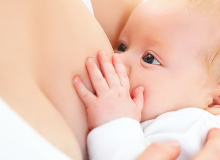 Mother breastfeeding infant child